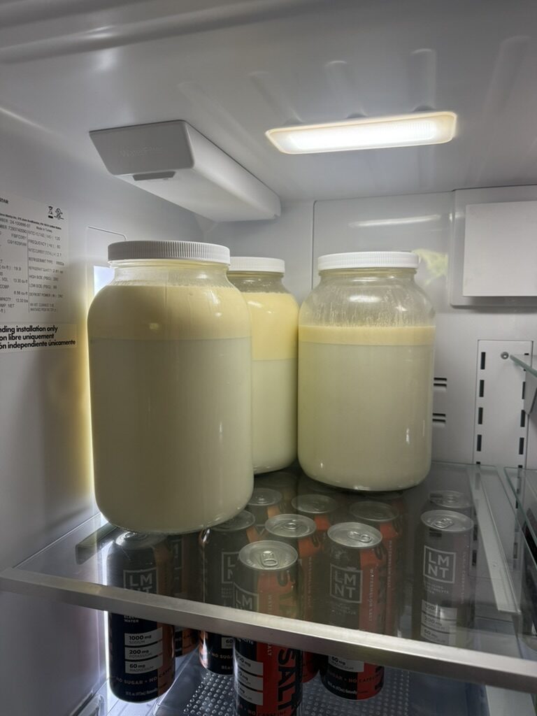 Glass jars of raw milk